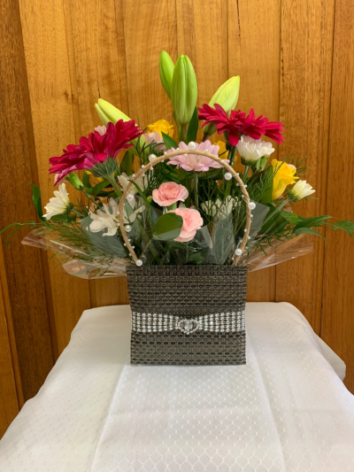 Bag of Blooms - A cute mini box made to look like a handbag filled with assorted blooms , colour of boxes may vary depending on patterns we have. Send a little something to make someone happy